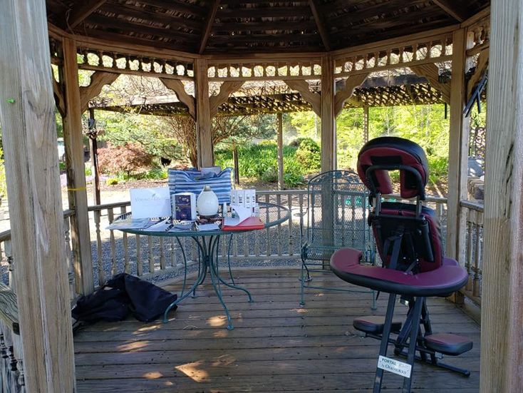 gazebo with massage chair and table